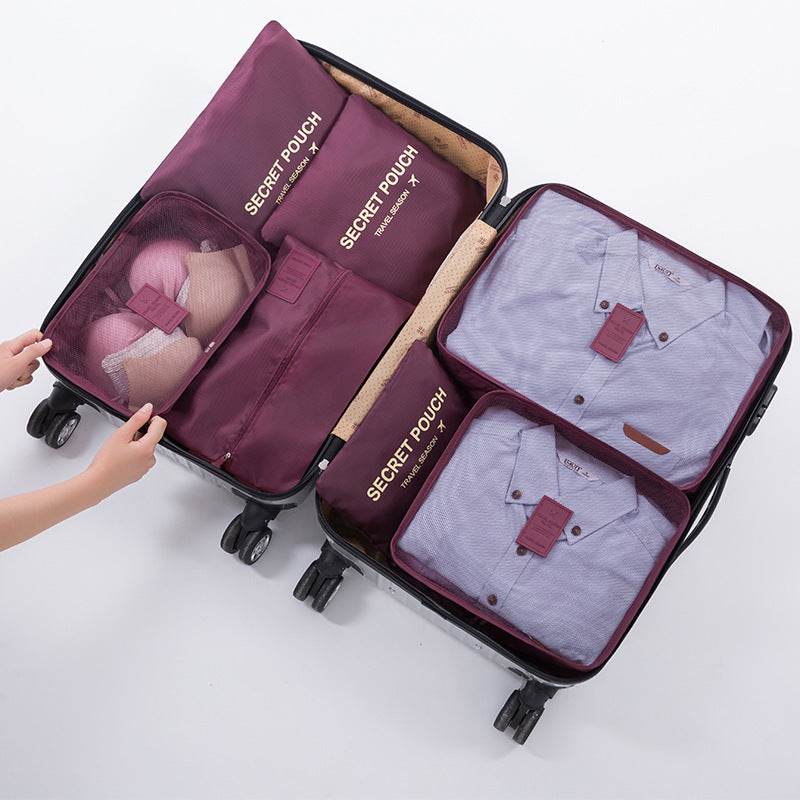 Travel luggage storage bag for organized packing with oxford cloth cubes.