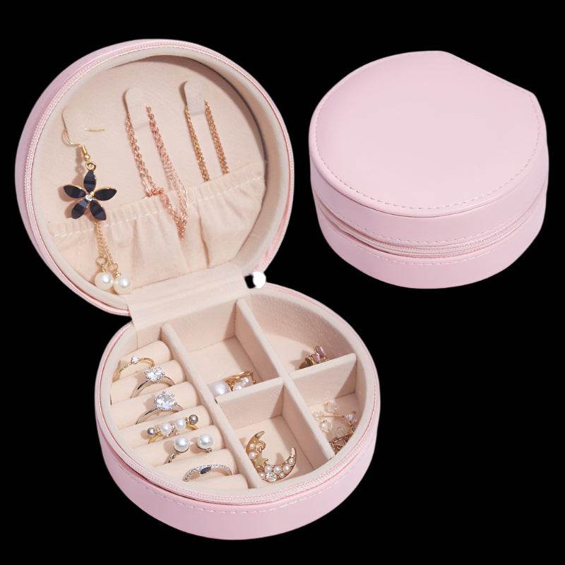 Travel portable accessories storage box in pink leather for jewelry and hair accessories.