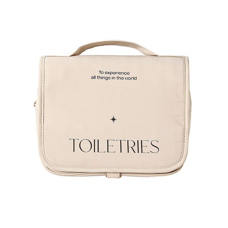 Travel storage toiletry bag with handle and star design.