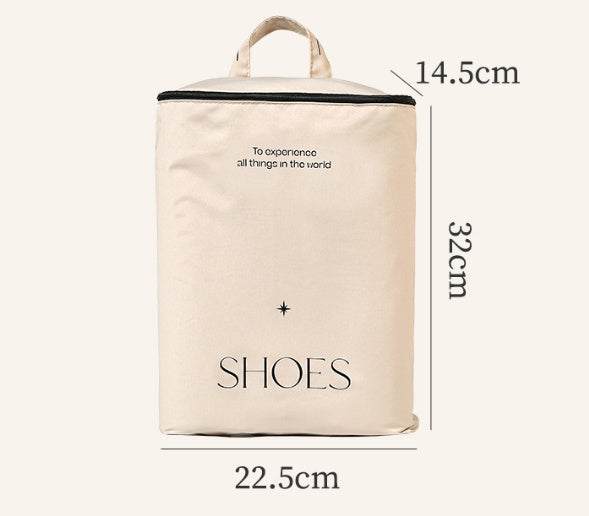 Travel storage bag for shoes with dimensions 14.5cm x 32cm x 22.5cm, beige color, featuring a handle and text design.