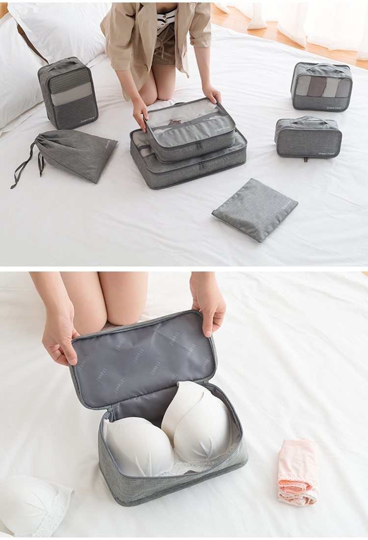 Set of 7 waterproof travel tote bags in various sizes, shown in gray color, ideal for organizing and fashionably packing for travel.