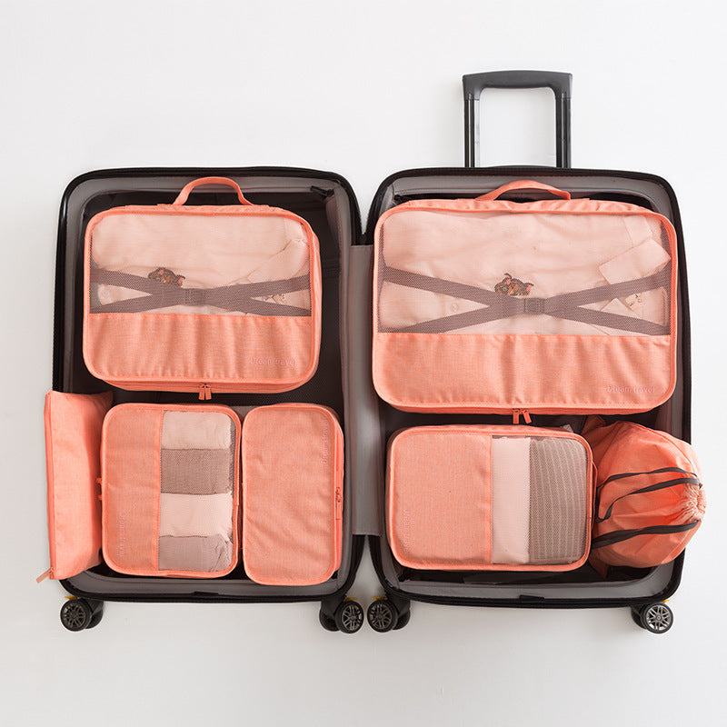 Waterproof travel tote bag set of 7 inside an open suitcase, featuring various organized compartments.