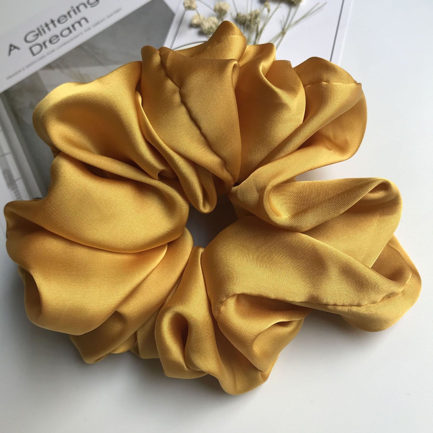 Oversized smooth satin large intestine circle hair tie in yellow, handmade for women.