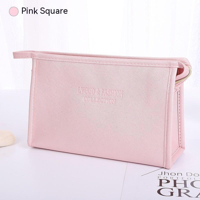 Waterproof storage bag in pink, medium-sized, square-shaped, PU leather, solid color, zipper closure, for travel and makeup.
