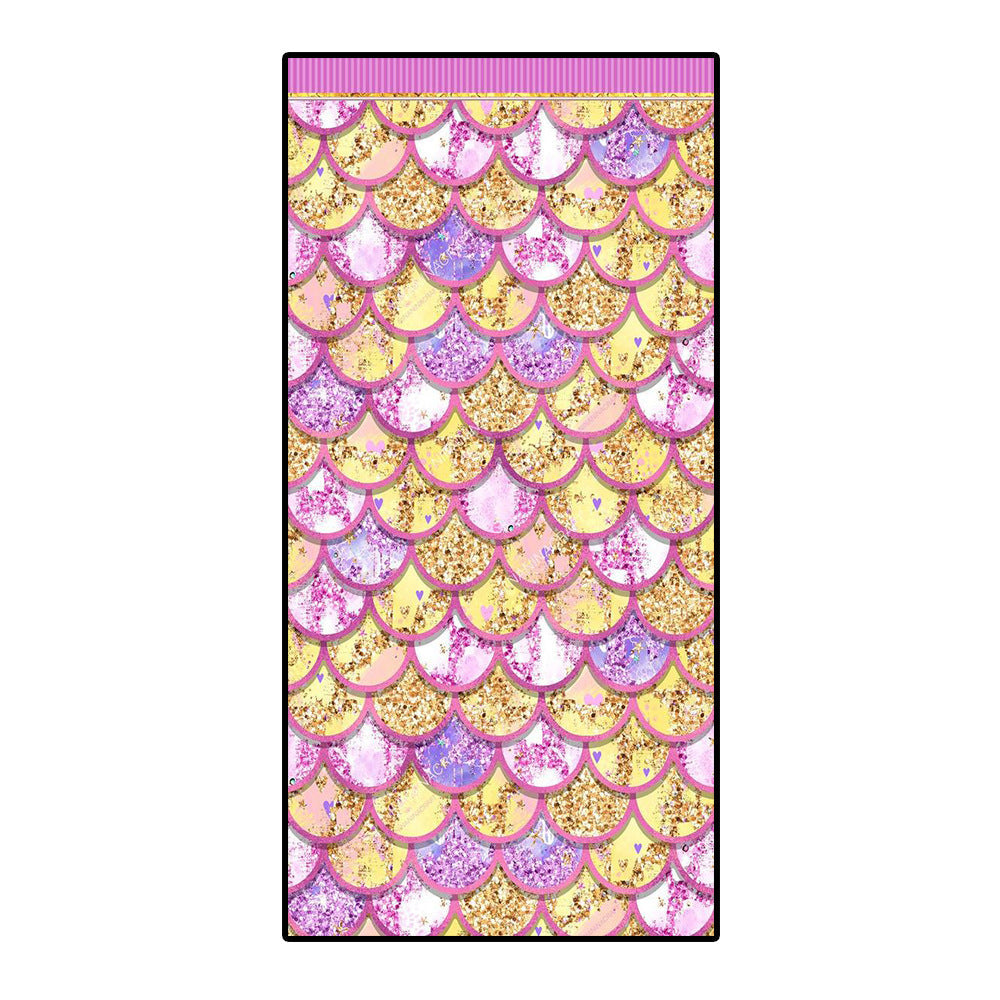 Colorful microfiber bath towel with mermaid scale pattern in yellow, pink, and purple.