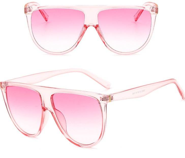 Sunglasses with pink gradient lenses and full frame design for women.
