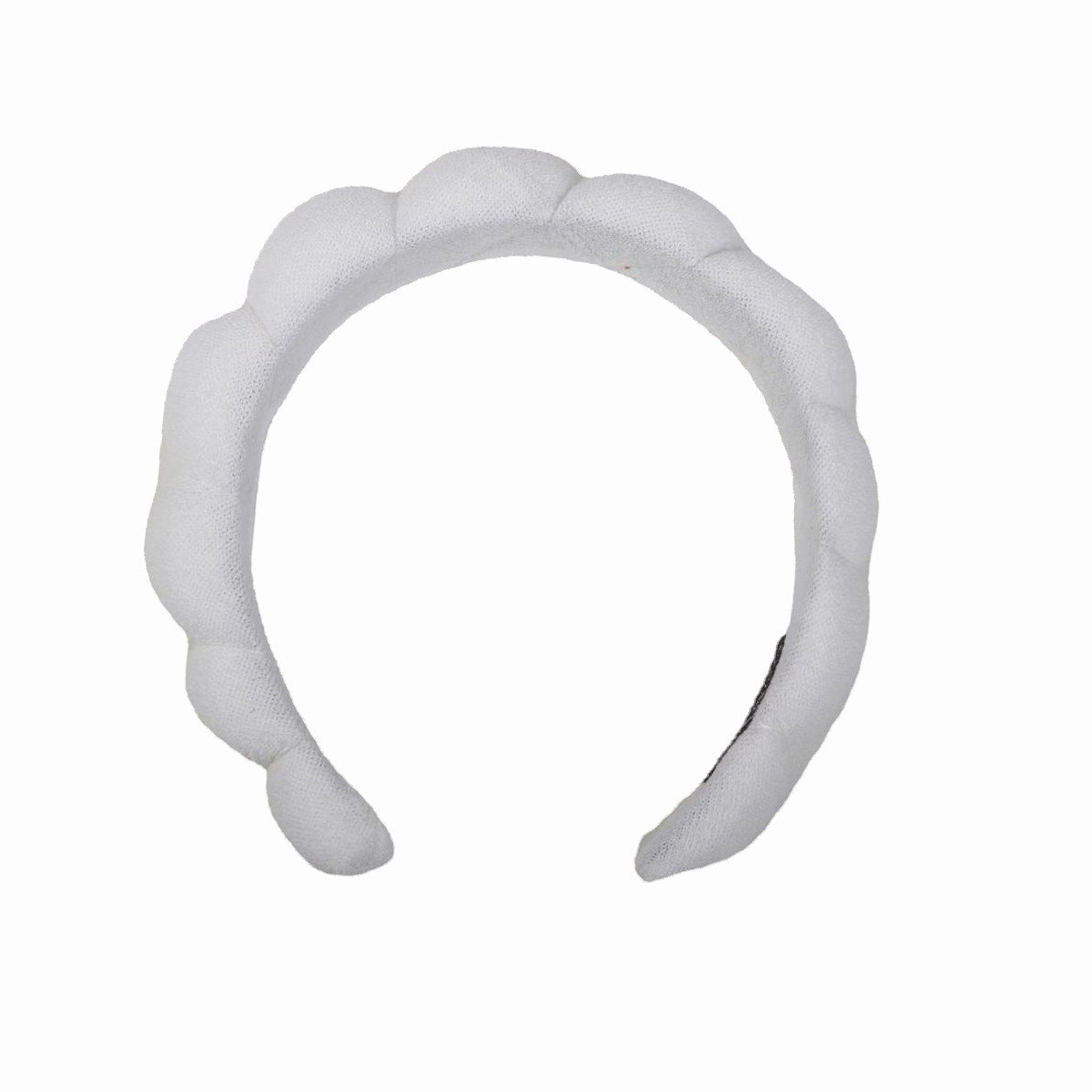 White cloth SPA headband for hair care.