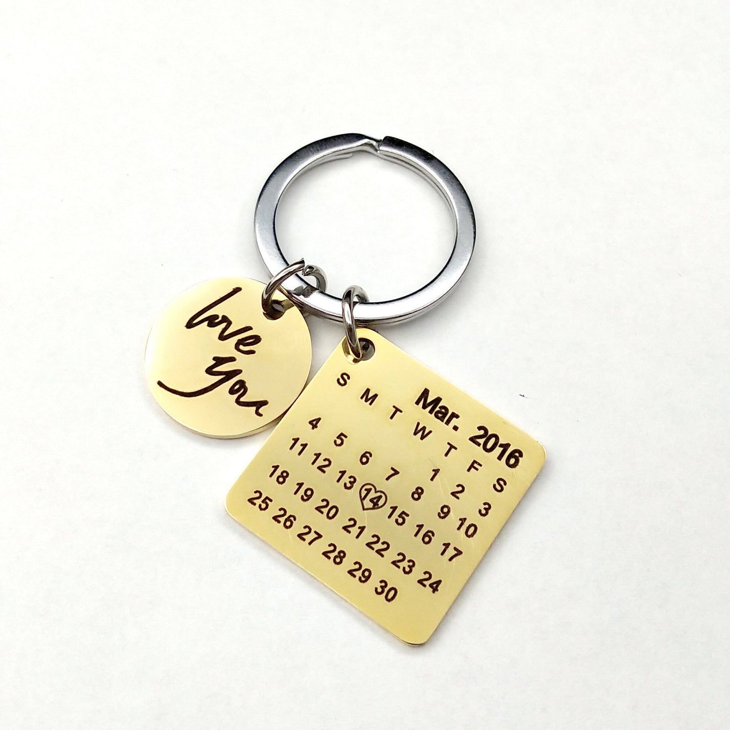 Custom DIY personalized calendar keychain with engraved date and "love you" charm, gold color.