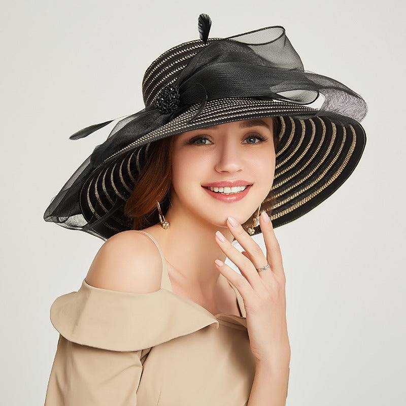 Big brim ladies sunshade hat with bows, made of papyrus and polyester fiber.