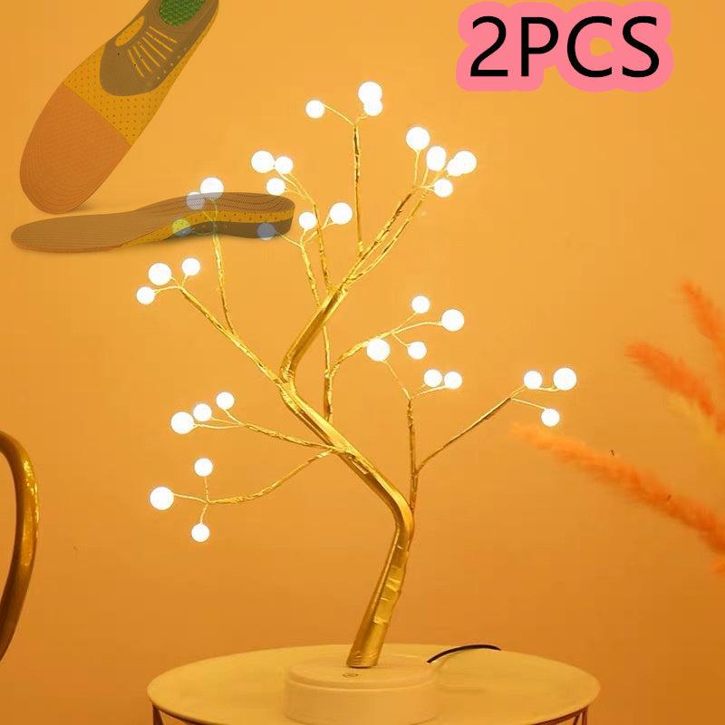LED copper wire light shaped like a glowing tree with white LED beads on an orange background