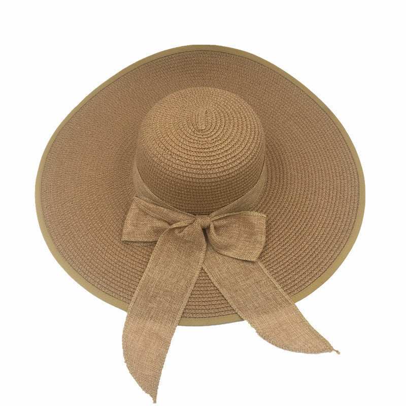 Ladies foldable straw hat with big brim, ideal sun protection shade for summer.