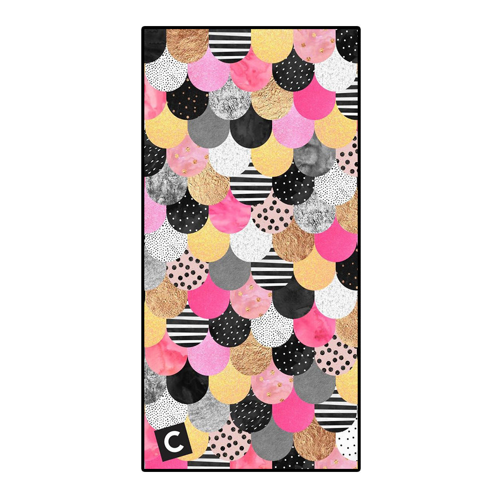 Colorful microfiber bath towel with scallop pattern design.