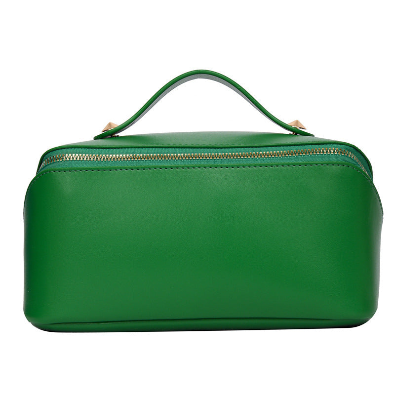 Green PU leather cosmetic bag with handle, women's large capacity portable storage.