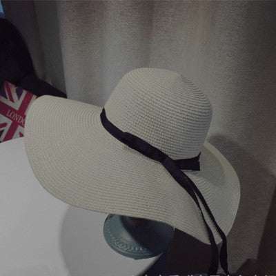 Women's straw woven dome sun hat with big brim and black ribbon, available in khaki, black, beige, and milky white.