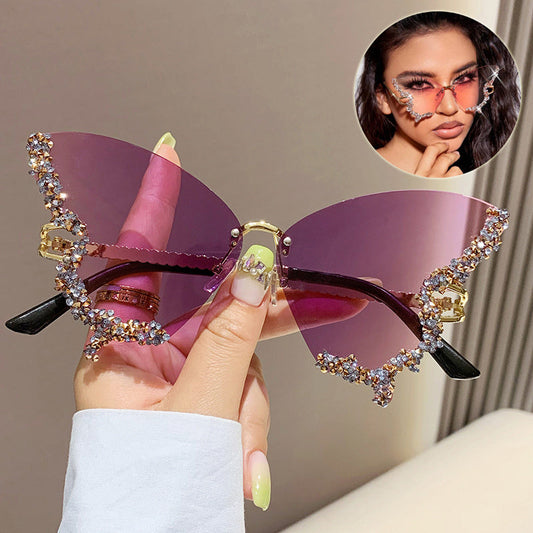 Luxury diamond butterfly sunglasses with a vintage rimless design, featuring gradient pink lenses and diamond embellishments, perfect for a stylish Y2K look.