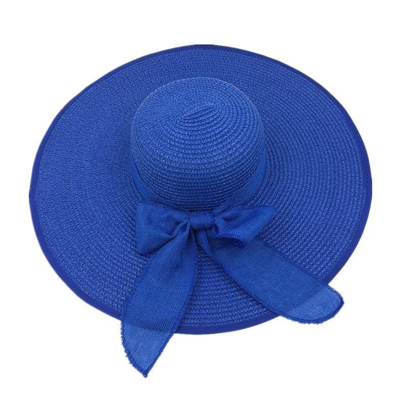 Ladies foldable sun protection shade big brim straw hat in blue color.