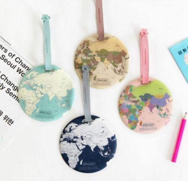 Colorful luggage tags with world map design for suitcase straps.