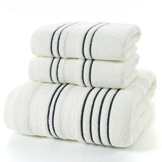 Household pure cotton towels in a stack, soft and skin-friendly, available in white with stripe pattern.