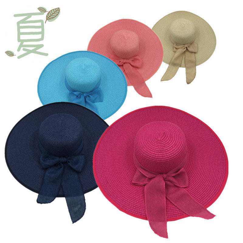 Ladies foldable straw hats with big brim for sun protection, available in assorted colors.