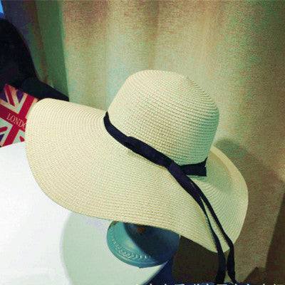 Women's straw woven big brim sun hat with dome style and black ribbon, available in khaki, black, beige, and milky white.