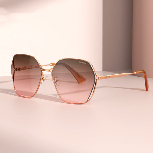 Elegant women's fashion gradient shades with metal frame and nylon lenses, featuring a gradual reddish-brown tint.