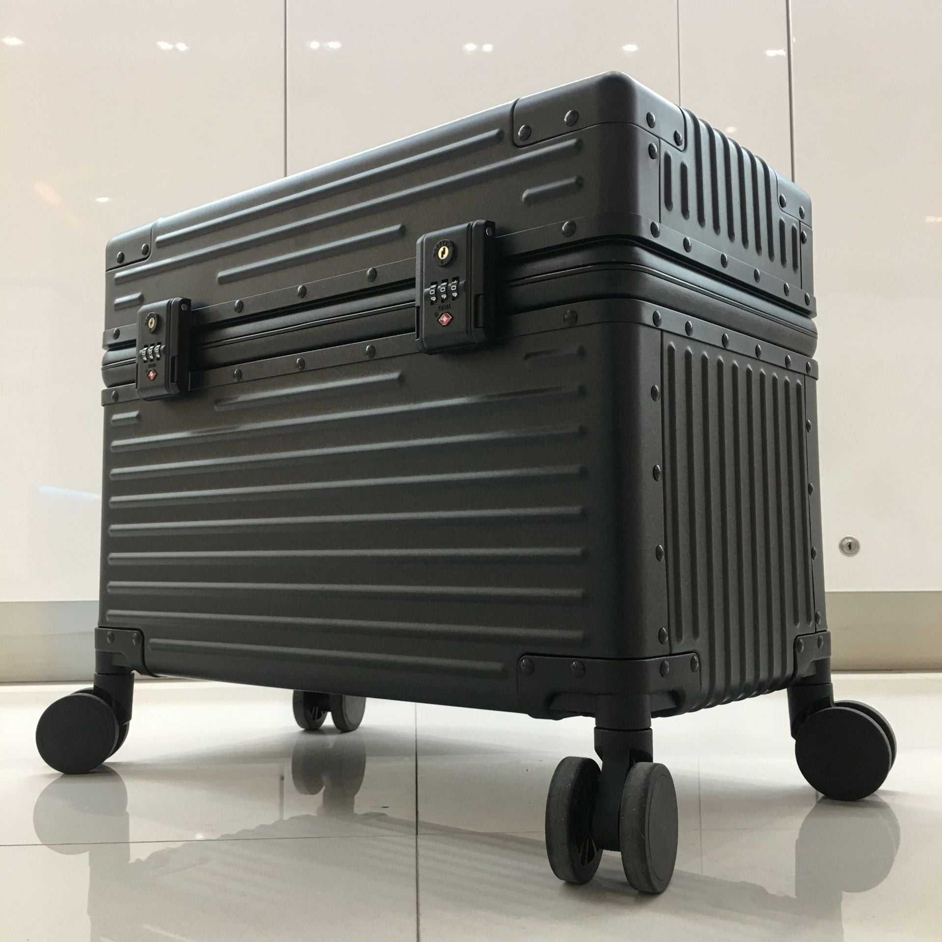 All-aluminum black trolley case with wheels and locks for travel photography.