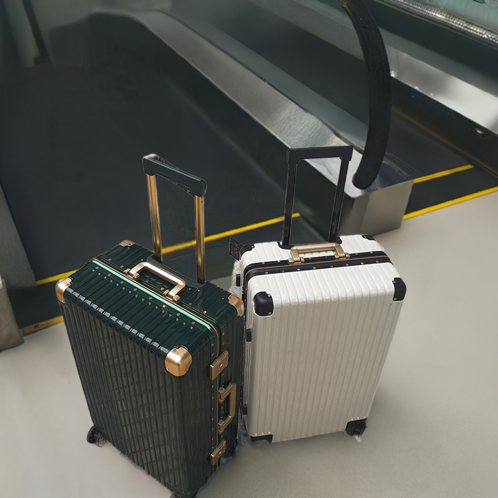 Aluminum alloy frame suitcases with universal wheels and locks on an airport conveyor.
