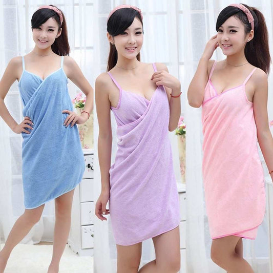 Women wearing stylish beach towels in blue, purple, and pink.