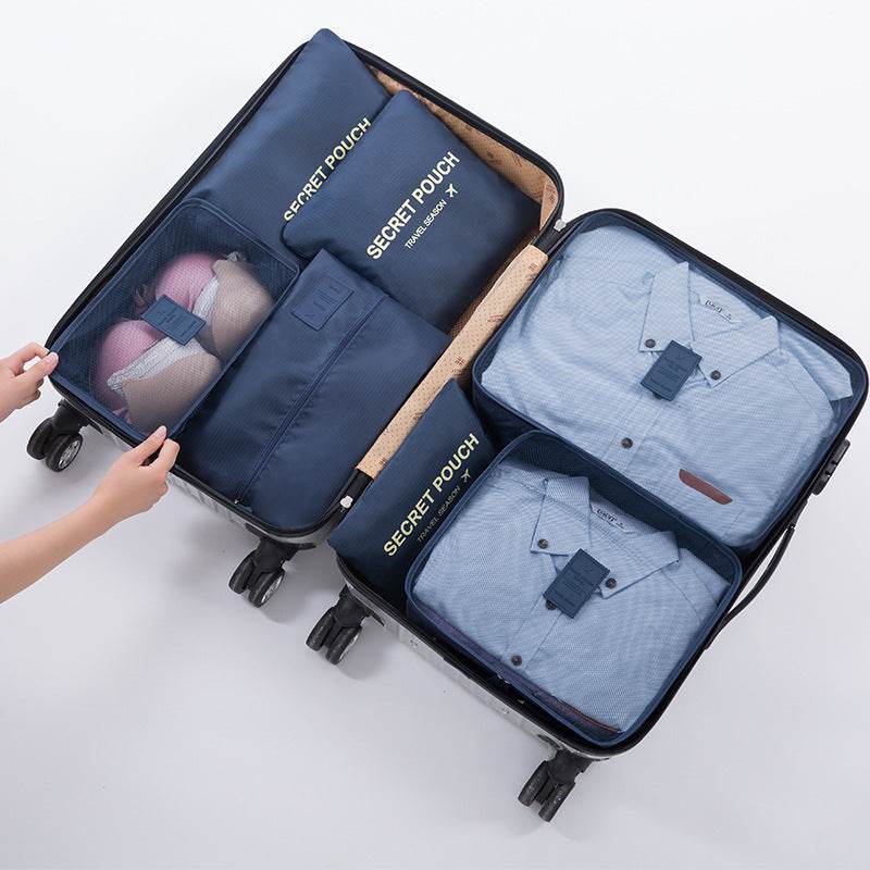 Travel luggage storage bag with various pouches and compartments, ideal for organizing travel essentials.