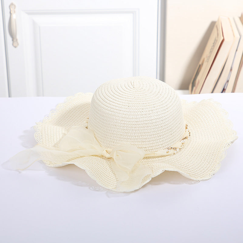 Big Eaves Beach Seaside Travel Sun Hat with Pearl Chain Ribbon in Beige.